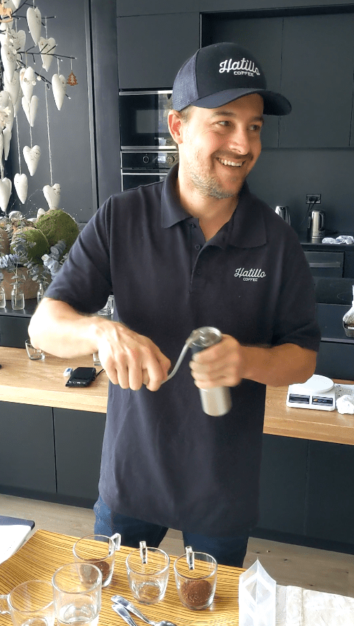 picture showing Miguel Echeverri, Hatillo Coffee's  Chief Quality Officer, grinding specialty coffee for cupping test