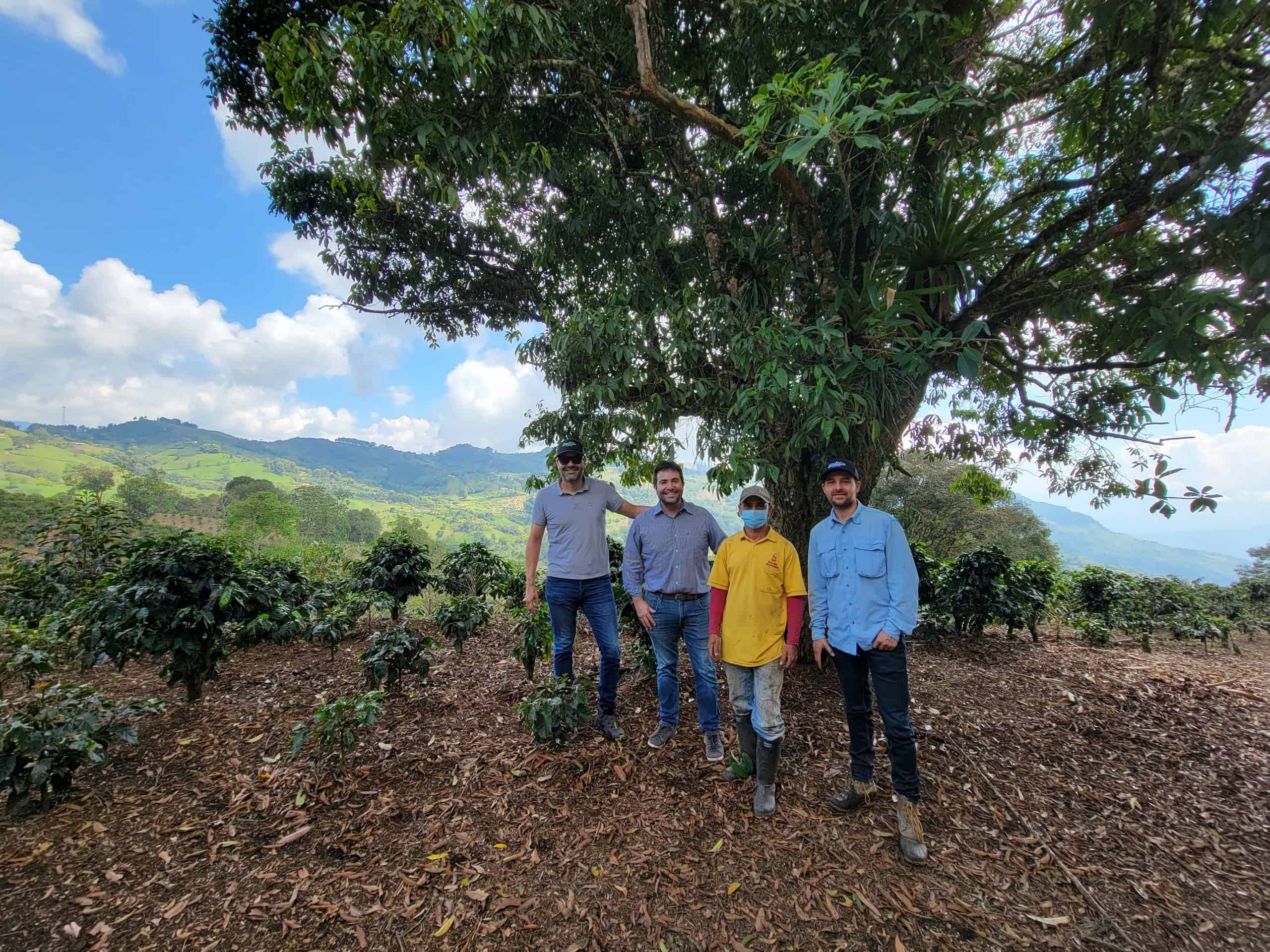 picture showing from left to right, Jaime Rodriguez CEO and co-founder of Hatillo Coffee, Felipe Mejia, Adolfo coffee farmer of "La Melisa" farm, and Miguel Echeverri Hatillo Coffee's co-founder and chief quality officer, near Fredonia, Antioquia - Colombia at "La Melisa" specialty coffee farm